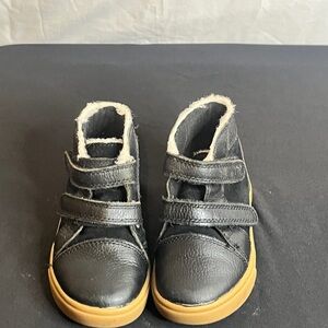 UGG Black and Tan Boots with Classic Design